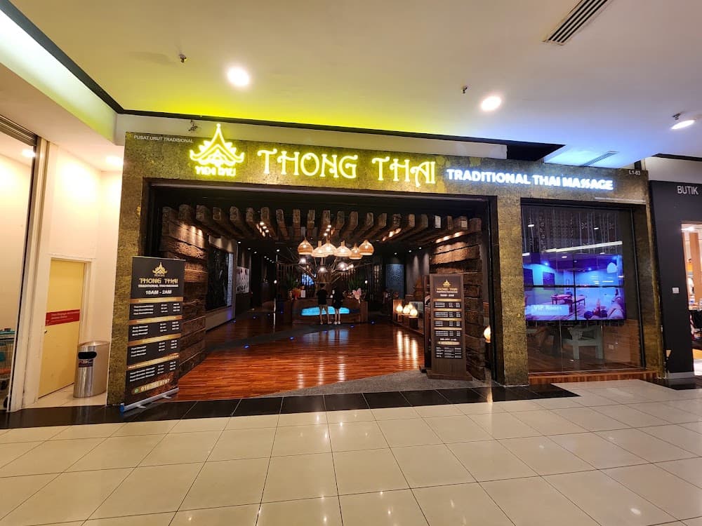 Thong Thai Traditional Thai Massage storefront with a rustic entrance and warm, inviting interior lighting.